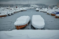 Boat under a winter cover with snow