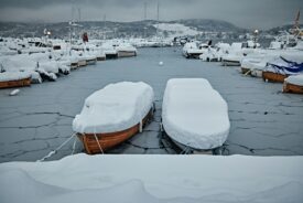 Boat under a winter cover with snow