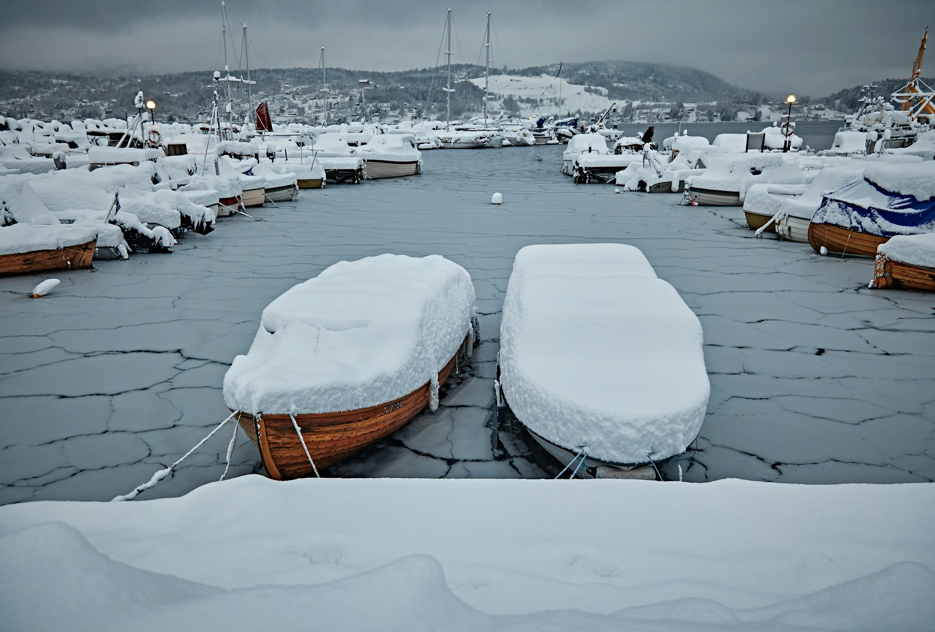 Boat under a winter cover with snow